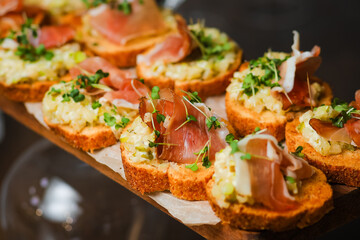 Catering service. Table with snacks food at event.