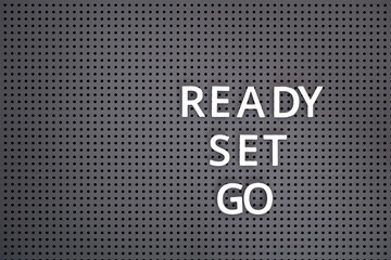 Words Ready, Set, Go spelled out with white letters on pegboard