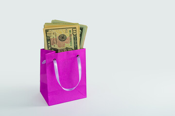 shopping bag filled with US dollar bils isolated on white background, shopping spending concept
