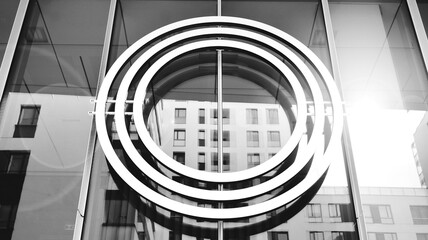 Detail in modern office building exterior. Glass building background. Fragment of new luxury office complex. Black and white.