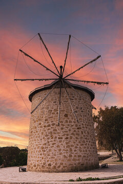 Windmill in Alacati during sunset, Cesme in Izmir. Popular iconic building of tourism destination where is known Alacati. Windmill on sky background. Copy space on beautiful sky.