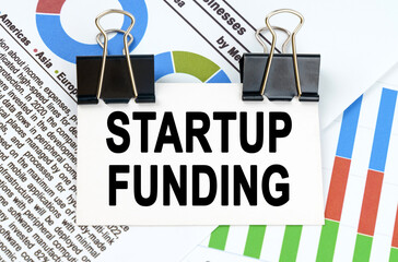 Among the reporting charts and diagrams is a plate with the inscription - STARTUP FUNDING