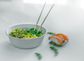 Fusion, asian and mediterranean salad in a white bowl with light background and soft light. Mediterranean and healthy diet.