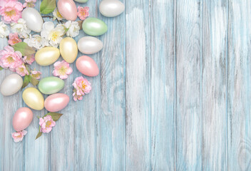 Easter eggs spring blossoms blue wooden background