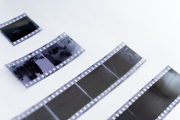 OLD PHOTO NEGATIVES ON WHITE BACKGROUND