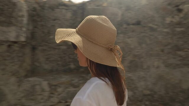 Young woman traveler walk and explore of the ancient city ruins of antique Xanthos town. Turkey