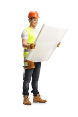 Full length shot of a construction worker holding a blueprint