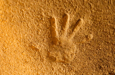 Silhouette of a hand in stone