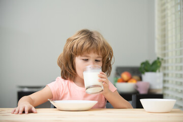 Organic milk with calcium. Little child drink milk. Kid eating healthy food.