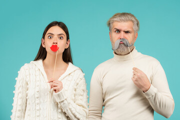 Couple with with fake mustache and lips. Having fun. Photo booth concept. Couple having fun with with fake mustache and lips.
