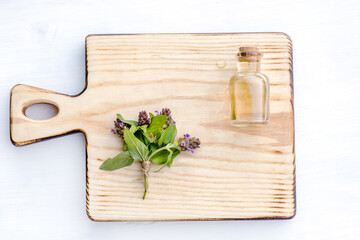 Prunella vulgaris, self-heal, carpenter's herb purple flower tincture on wooden cutting board ready for drying and making tea and infusions. Useful herb for use in cosmetology and alternative medicine