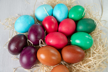preparation for Easter, colorful eggs in a nest of straw