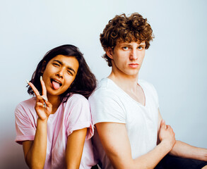 best friends teenage girl and boy together having fun, posing emotional on white background, couple happy smiling, lifestyle people concept, blond and brunette multi nations