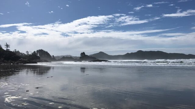 Waves of Pacific Ocean hitting shores near Pacific Rim National Park Reserve - popular surfing destination located between Tofino and Ucluelet on the west side of Vancouver Island 