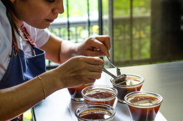 Professional coffee taster testing new smells and flavors.