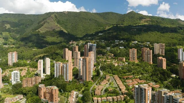 Beautiful Aerial View of Luxury Apartment Buildings in Medellin, Colombia Built into Andes Mountains on Clear Day