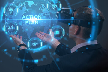 Business, Technology, Internet and network concept. Young businessman working on a virtual screen of the future and sees the inscription: Action plan