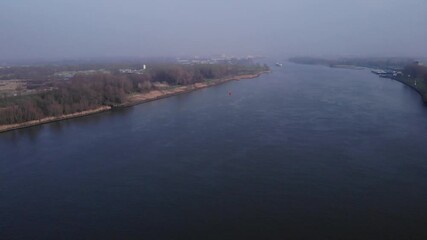 Aerial view of a red navigation marker in the water. Flying over the river