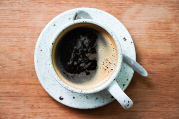 Top view of coffee cup on a wood background with copy space. hot coffee cup on a wooden table