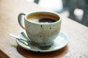 hot coffee cup on a wooden table