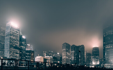 Fototapeta na wymiar Modern office buildings in Hong Kong at night time