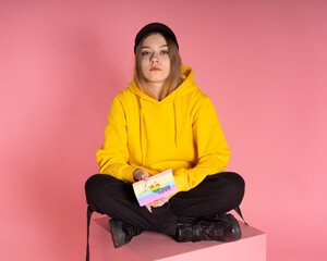 Sad woman with LGBT card