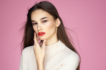 Beautiful brunette red lips white blouse close-up attractive view pink background