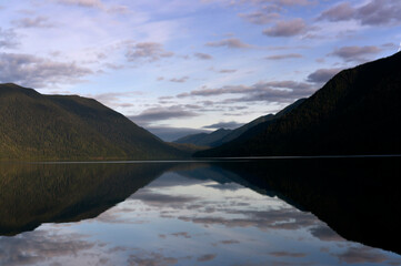 Mirror sky reflection and mountain  reflection on lake Crescent Olympic peninsula, Washington