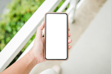 Women's hands holding cell telephone blank copy space screen. smart phone with technology concept