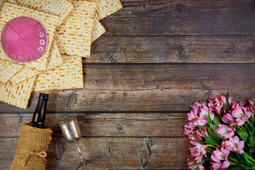 Passover symbols matzoh, red wine and flowers.
