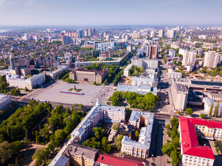Fototapeta na wymiar View from drone of residential areas and center of Voronezh city with Lenin Square, Russia