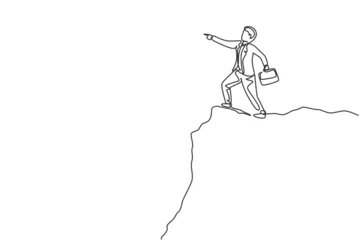 Papier Peint photo Lavable Une ligne Single one line drawing young smart business man standing at cliff edge pointing finger to the sky. Business metaphor concept. Modern continuous line draw. Minimal design graphic vector illustration