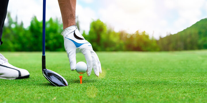 Close up golf ball on green grass field