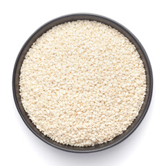 Macro Close up of Organic White  Sesame seeds(Sesamum indicum) polished or white Til without shell inside a black ceramic bowl