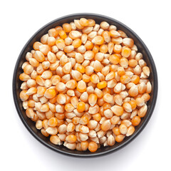 Macro Close up organic yellow corn seed or maize (Zea mays) inside a black ceramic bowl. Top View