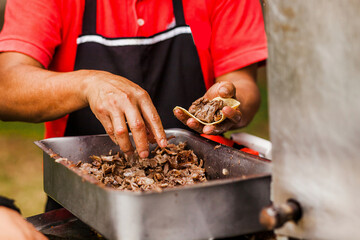 cooking Mexican tacos with beef, traditional street food in Mexico city