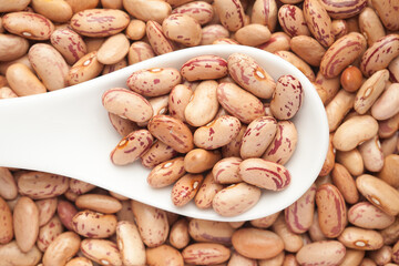 macro Close-up of Organic Lobia,  ( Lobia ) or kidney beans dal on a white ceramic soup spoon. Top view