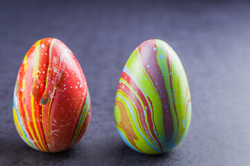 Colorful Easter eggs lined up side by side.