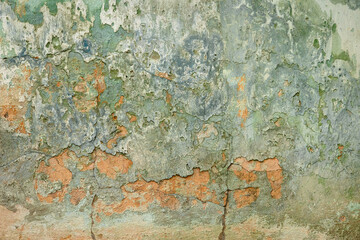 Fototapeta na wymiar painted plaster wall with pain flakes for background