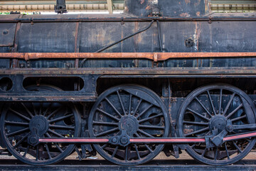 Fototapeta na wymiar Old steam engine train wheels_01
