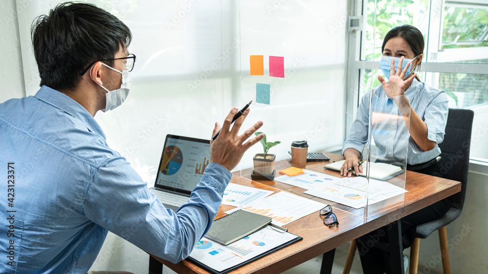 Poster two business colleagues wearing face mask to brainstorming business project and giving high five to 