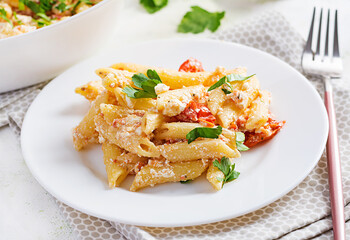 Fetapasta. Trending Feta bake pasta recipe made of cherry tomatoes, feta cheese, garlic and herbs.