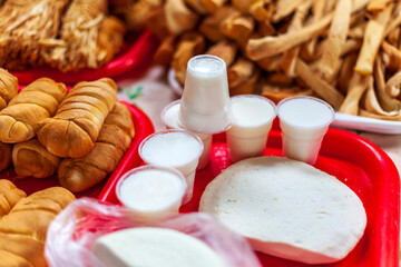 The central market of the city of MaikopSmoked cheese pigtail, Traditional Polish smoked cheese, Chechil cheese,