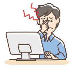 パソコンの業務で疲れ目の男性