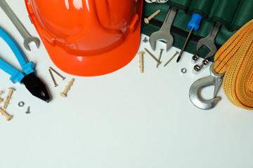 Concept of Labor Day with construction tools on white background