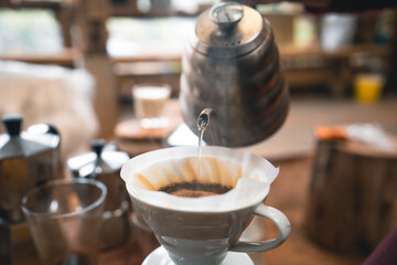 Drip coffee hot water from the kettle into the coffee.