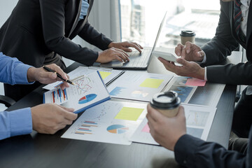Meeting business team leaders about charts, financial graphs showing results are analyzing and calculating planning strategies, business success building processes