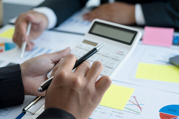 Meeting business team leaders about charts, financial graphs showing results are analyzing and calculating planning strategies, business success building processes