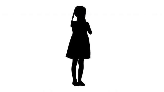 Silhouette Delighted girl in black dress clapping her hands.