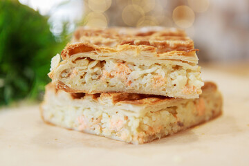 Chicken and potato pie on the dining table. The food is ready to eat. Puff pastry. kitchen utensils for cooking